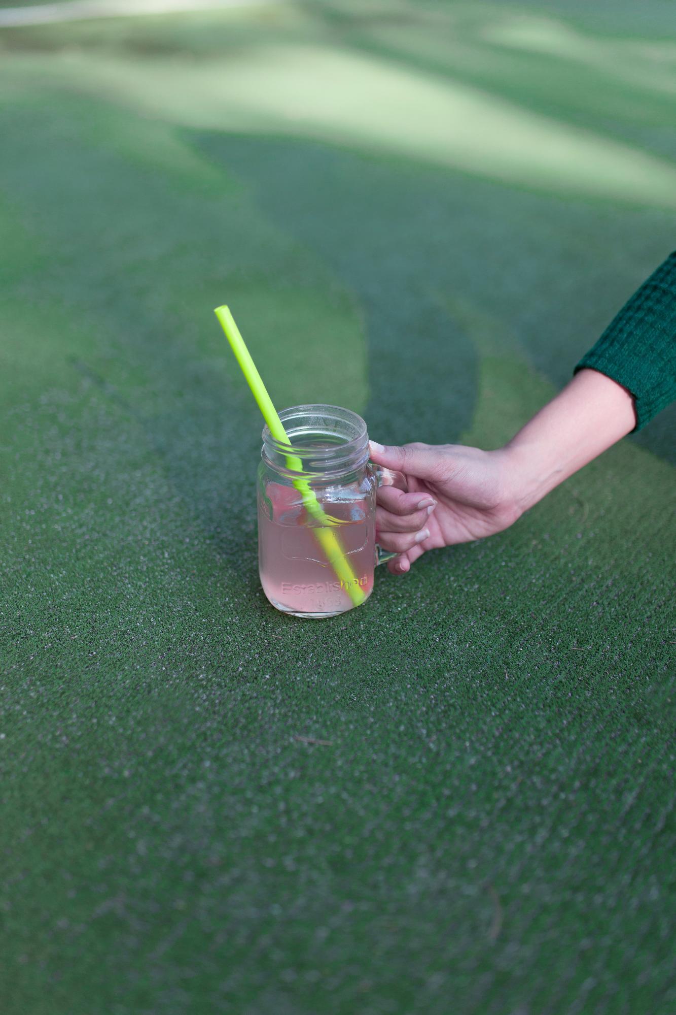 Rinsing artificial turf with garden hose